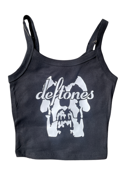 A black tank top with a white graphic design featuring the text "deftones" and a stylized image of a skull or skull-like shape.