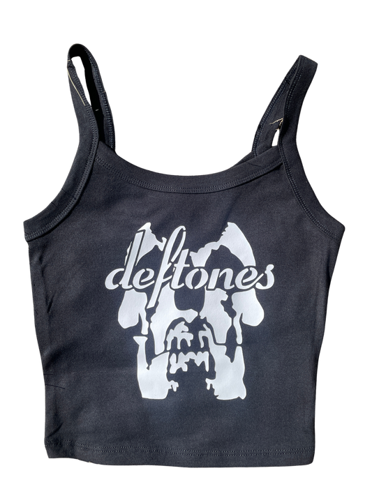 A black tank top with a white graphic design featuring the text "deftones" and a stylized image of a skull or skull-like shape.