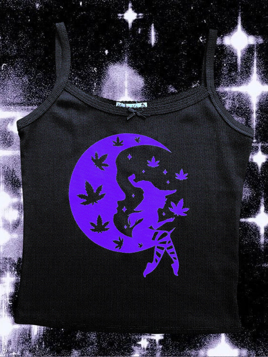 Black spaghetti strap tank top with a purple print of a seated witch on a crescent moon, surrounded by floating cannabis leaves and stars. The background is a cosmic, sparkly black-and-white space scene.