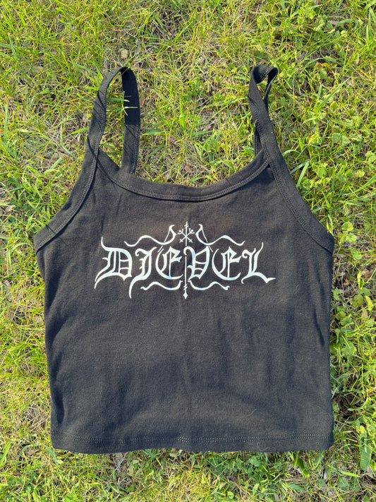 A black tank top with white text printed on it, lying on a grassy surface.