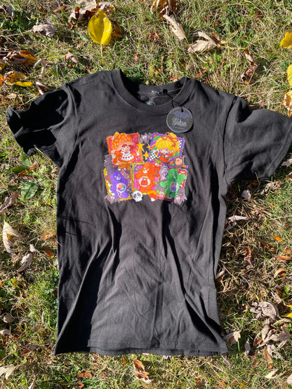 a t - shirt laying on the ground in the grass