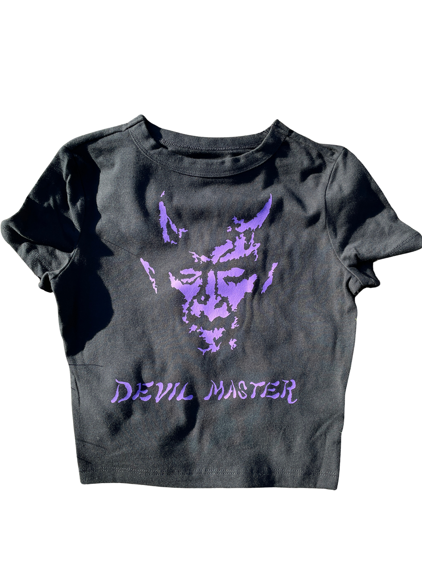 A gray t-shirt with a purple graphic design depicting a devil-like face and the text "Devil Master" printed on it.