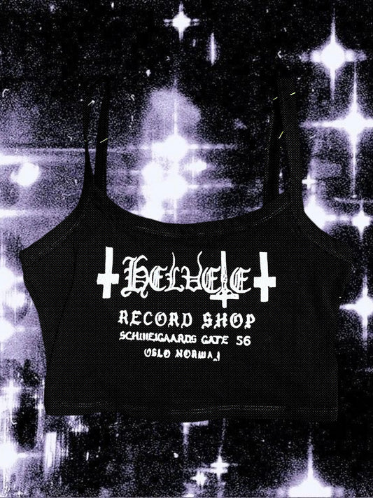 Black cropped spaghetti strap cami with “Helvete Record Shop” printed in white glitter vinyl. The design includes gothic text, upside-down crosses, and the address "Schweigaards Gate 56, Oslo Norway." Shirt is laid flat on a cosmic black-and-white starry background.