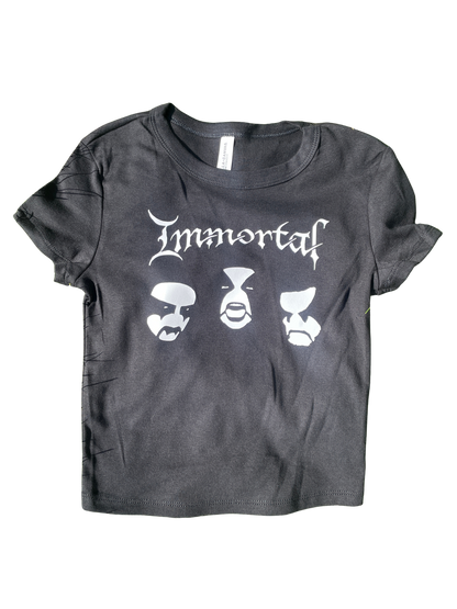A gray t-shirt with the text "Immortals" printed on it, along with three stylized faces.