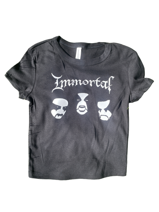 A gray t-shirt with the text "Immortals" printed on it, along with three stylized faces.
