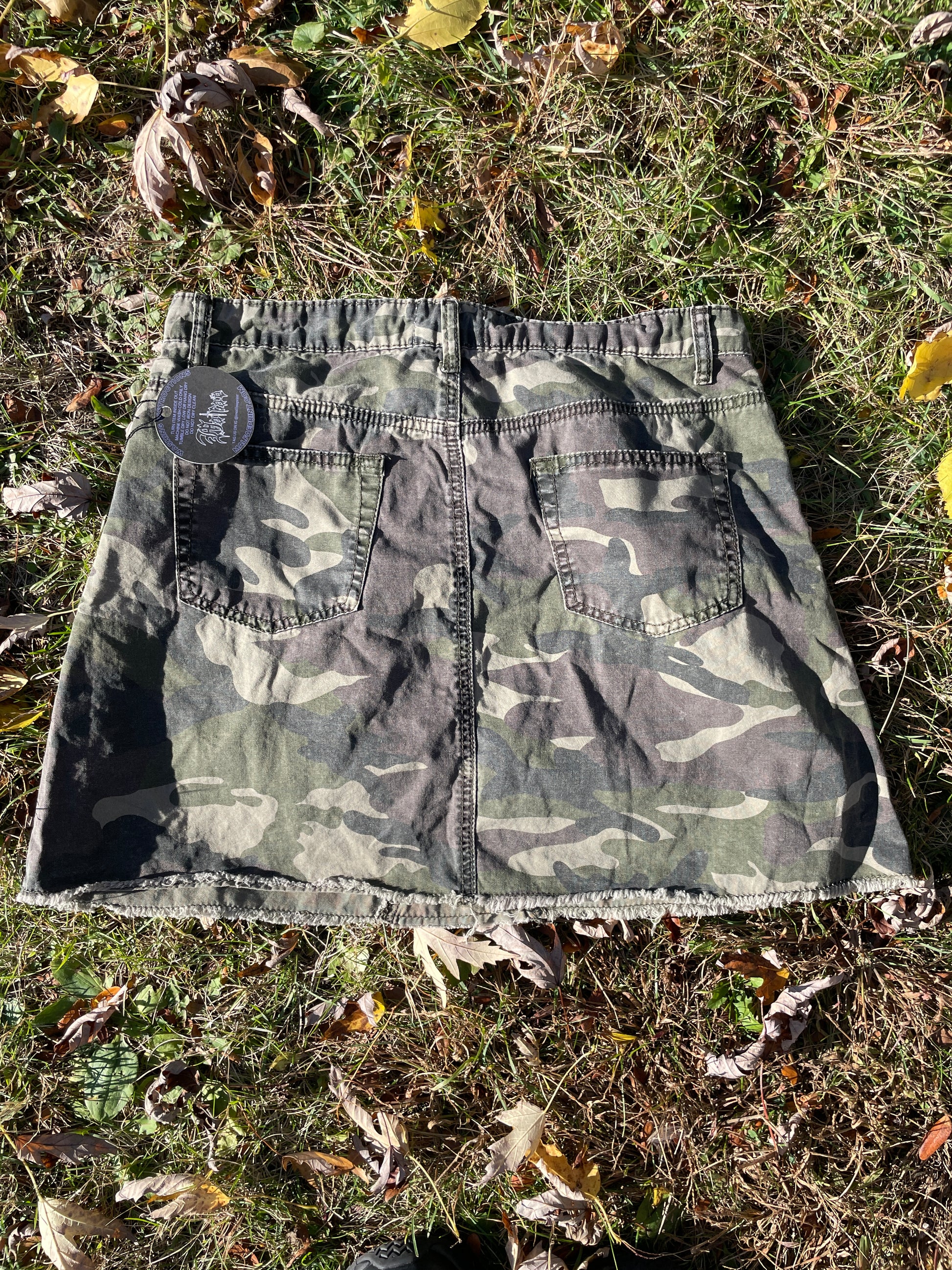 a camouflage cloth laying on the ground