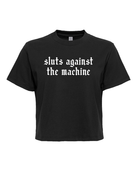 A black t-shirt with white text that reads "sluts against the machine".