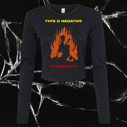 a women's black sweater with an orange fire graphic on it