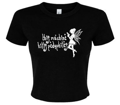 The image is a black t-shirt with a white graphic design depicting a fairy-like figure holding a sign that says "This machine kills pedophiles".